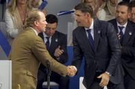 Team USA captain Steve Stricker shakes hands with Team Europe captain Padraig Harrington during the opening ceremony for the Ryder Cup at the Whistling Straits Golf Course Thursday, Sept. 23, 2021, in Sheboygan, Wis. (AP Photo/Charlie Neibergall)