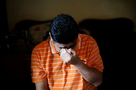 Melvin Garcia, 37, a deportee from the U.S. who was separated from his daughter Daylin Garcia, 12, at the McAllen entry point under the Trump administration's hardline immigration policy, gestures during an interview with Reuters in Choloma, Honduras June 21, 2018. Picture taken on June 21, 2018. REUTERS/Carlos Jasso