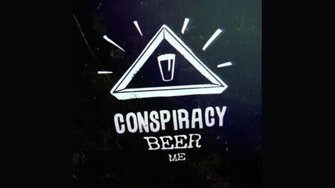 a beer logo inside a white triangle