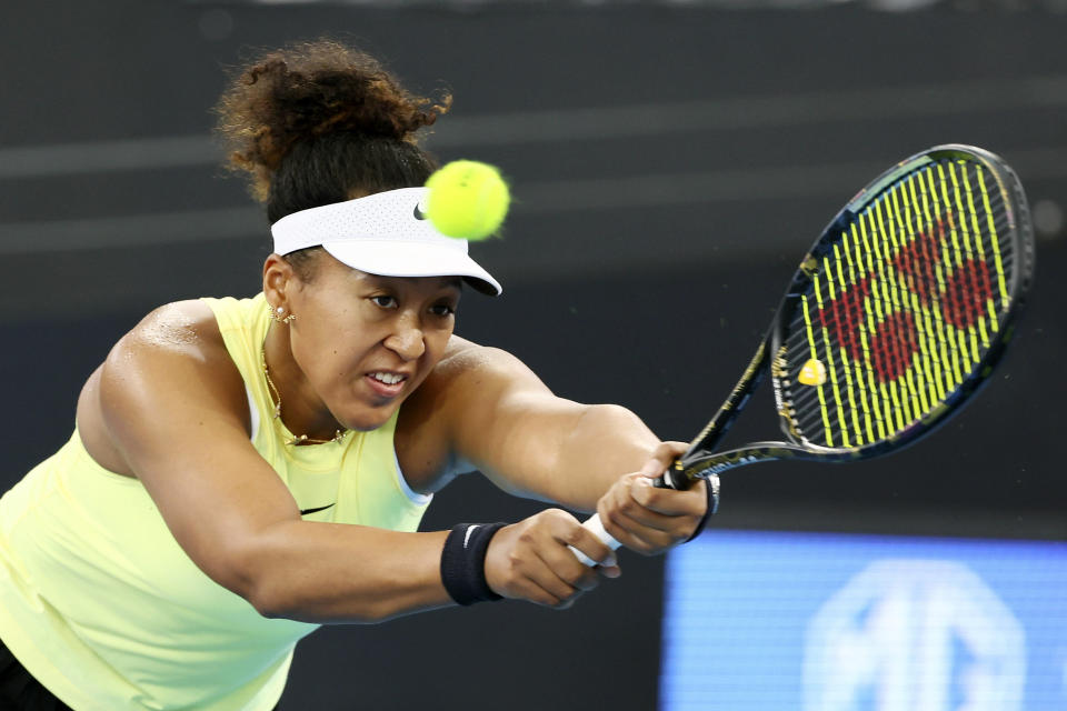 FILE - Naomi Osaka of Japan plays a shot in her match against Karolina Pliskova of the Czech Republic during the Brisbane International tennis tournament in Brisbane, Australia, Wednesday, Jan. 3, 2024. The Australian Open will mark four-time major champion Naomi Osaka's return to Grand Slam action. Play begins in Melbourne on Sunday morning (Saturday night ET). (AP Photo/Tertius Pickard, File)