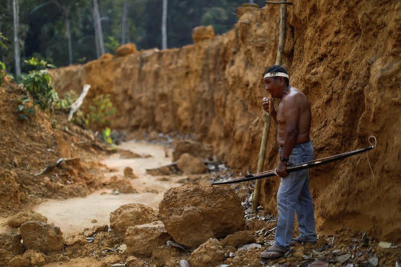 FILE PHOTO: An Indigenous named Raimundo Praia from Mura people looks on in a deforested area of a non-demarcated indigenous land in the Amazon rainforest near Humaita