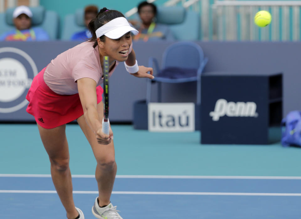Hsieh Su-Wei, of Taiwan, returns to Naomi Osaka, of Japan, during the Miami Open tennis tournament, Saturday, March 23, 2019, in Miami Gardens, Fla. (AP Photo/Lynne Sladky)