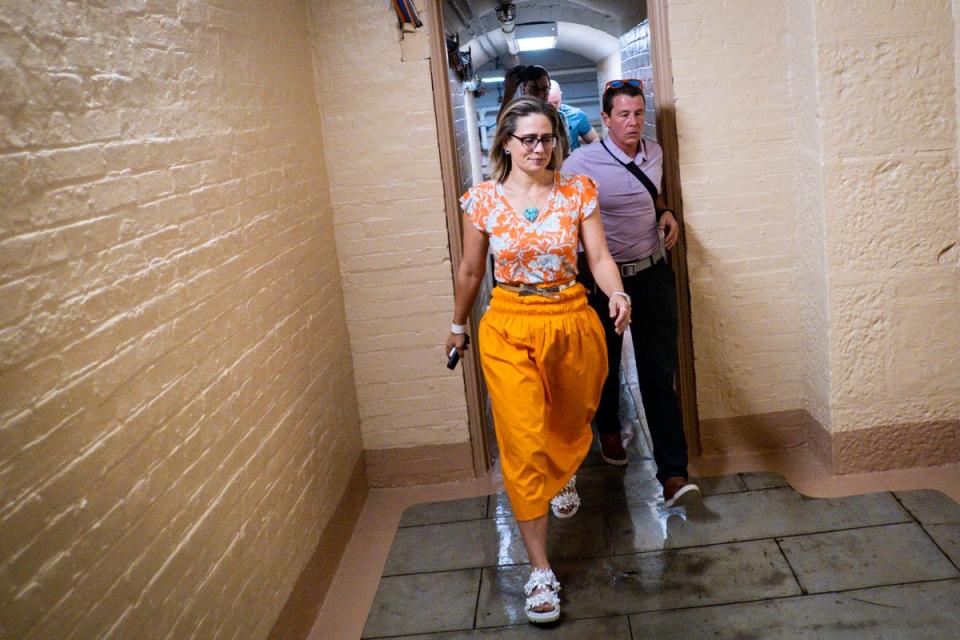 Democratic Senator Kyrsten Sinema makes her way to the Senate floor on 4th August, 2022 (EPA)