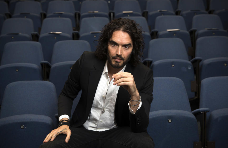 LONDON, ENGLAND - NOVEMBER 25:  Russell Brand poses for photographs as he arrives to deliver The Reading Agency Lecture at The Institute of Education on November 25, 2014 in London, England. Russell Brand will deliver 'a manifesto on reading' which will be in part personal, sharing his own experience of books and reading while growing up in the UK.  (Photo by Carl Court/Getty Images)