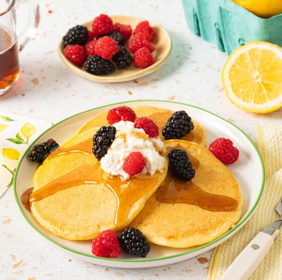 lemon ricotta pancakes with mixed berries and whipped cream