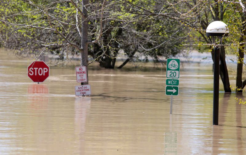 A general view shows a flooded street along the Tittabawassee River, after several dams breached, in downtown Midland