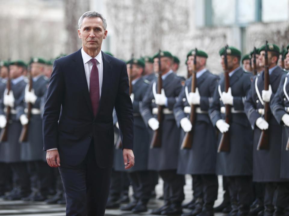 NATO Secretary General Jens Stoltenberg reviews a guard of honour during a welcoming ceremony at the Chancellery in Berlin January 14, 2015. REUTERS/Hannibal Hanschke (GERMANY - Tags: POLITICS)