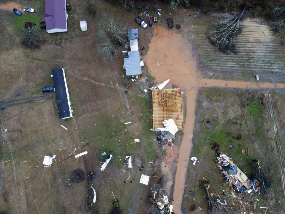 Devastation is seen in the aftermath from severe weather, Thursday, Jan. 12, 2023, in Greensboro, Ala. A giant, swirling storm system billowing across the South spurred a tornado on Thursday that shredded the walls of homes, toppled roofs and uprooted trees. (Mike Goodall via AP)