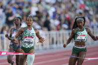 Sha'Carri Richardson nears the finish line to take second place in the women's 200 meters final during the U.S. track and field championships in Eugene, Ore., Sunday, July 9, 2023. Right is Twanisha Terry who finished fifth. (AP Photo/Ashley Landis)