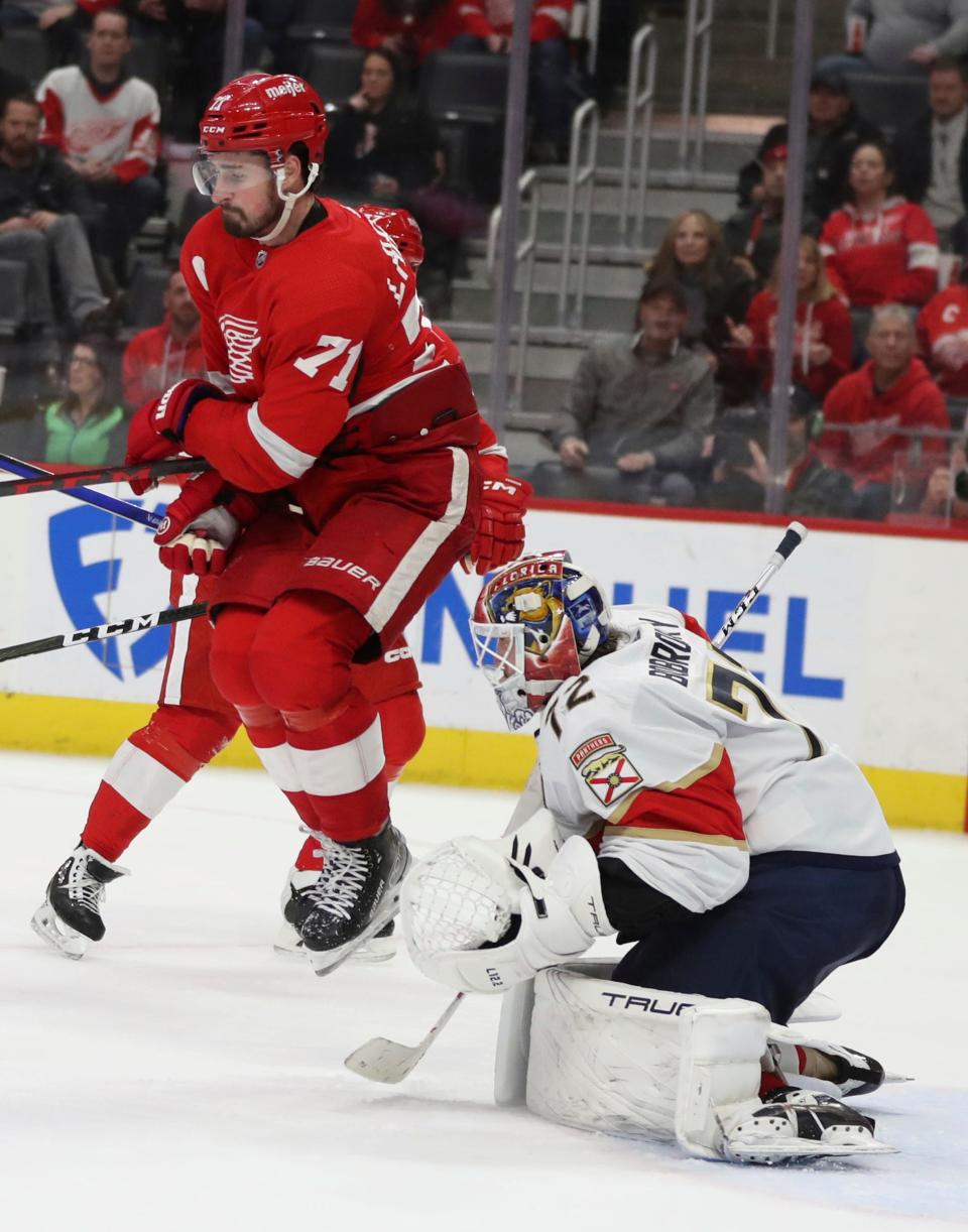 Red Wings center Dylan Larkin goes airborne as Panthers goaltender Sergei Bobrovsky makes a save during the third period of the Wings' 3-2 loss to the Panthers on Friday, Jan. 6, 2023, at Little Caesars Arena.