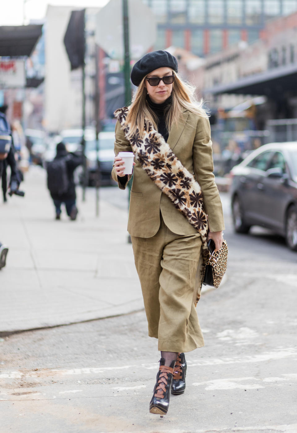 <p>Dress like a Parisian by pairing a light khaki suit with a chic beret, furry bag, and winter boots. If it’s extra frigid that day, throw on a minimalist overcoat in grey or tan. (Photo: Getty) </p>