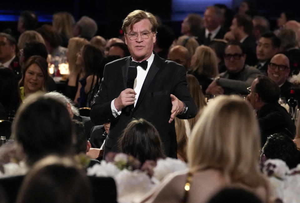 Writer/director Aaron Sorkin speaks about actor Nicole Kidman, foreground right, during the 49th AFI Life Achievement Award tribute to her, Saturday, April 27, 2024, at the Dolby Theatre in Los Angeles. (AP Photo/Chris Pizzello)