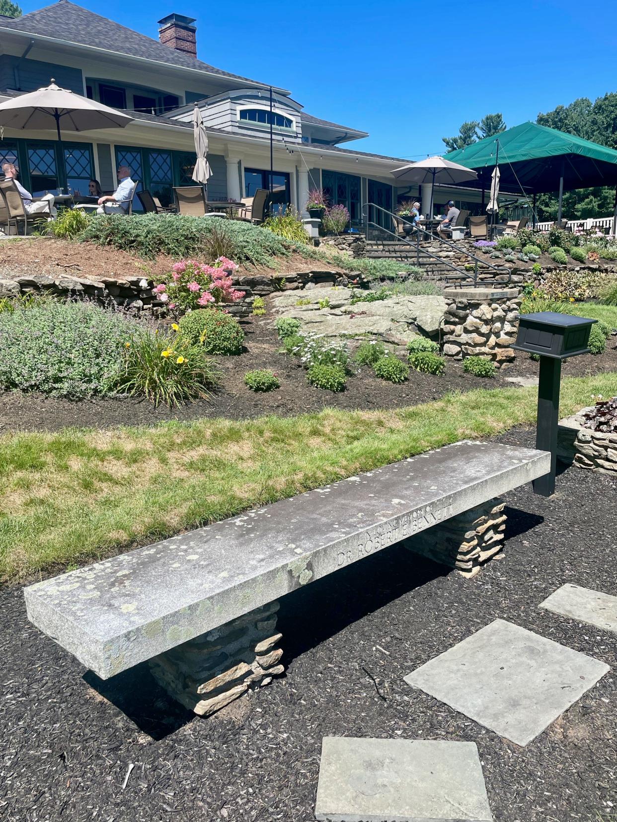 The granite bench at Tatnuck CC dedicated to the late Dr. Robert Bennett.