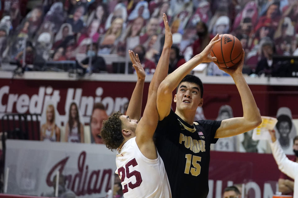 Purdue's Zach Edey (15) shoots over Indiana's Race Thompson (25) during the first half of an NCAA college basketball game, Thursday, Jan. 14, 2021, in Bloomington Ind. (AP Photo/Darron Cummings)