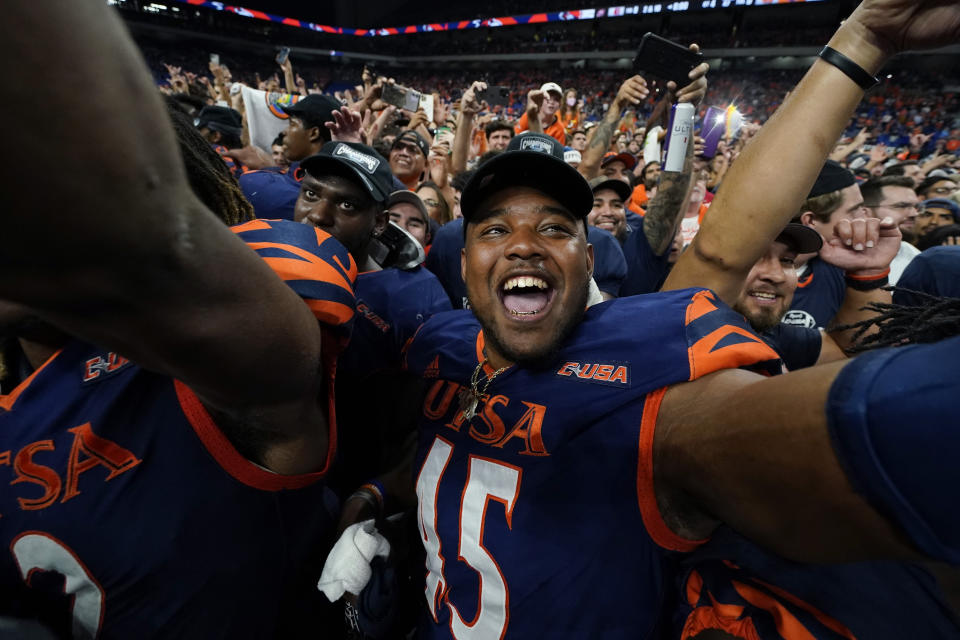 UTSA tight end Ke'Chawn Compton (45) celebrates with teammates after their win over Western Kentucky in an NCAA college football game in the Conference USA Championship, Friday, Dec. 3, 2021, in San Antonio. (AP Photo/Eric Gay)