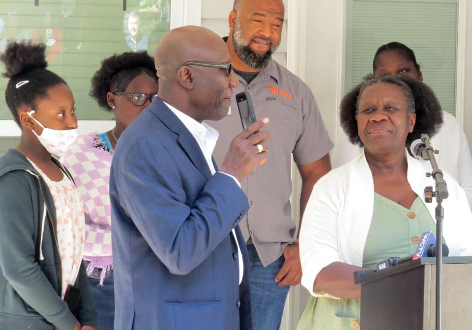 New homeowner and family at the Habitat for Humanity house dedication on April 1, 2022.