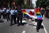 Members of Toronto's Police force take part in the LGBT Pride March in the Manhattan borough of New York City, New York, U.S. June 25, 2017. REUTERS/Carlo Allegri