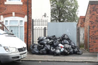 <p>The strikes have left piles of rubbish stacked up on streets in Birmingham [Picture: PA] </p>