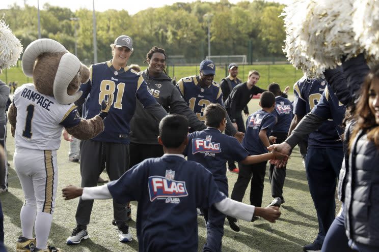 Members of the Rams, including their mascot, rubbed elbows with London-area children. (AP) 