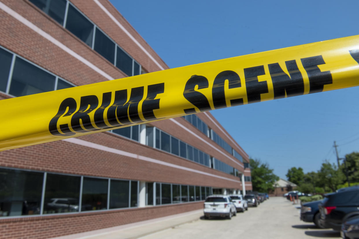 Crime scene tape blocks the Fairfax, Va., office building where police say a man wielding a baseball bat attacked two staffers of Rep. Gerry Connolly, D-Va., on Monday. (AP Photo/Cliff Owen)