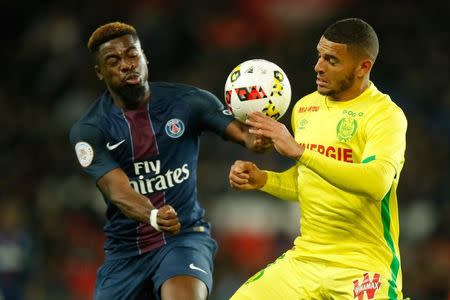 Football Soccer - Paris St Germain v Nantes French Ligue 1 - Parc des Princes, Paris, France - 19/11/16. Paris St Germain's Serge Aurier (L) challenges Nantes' Diego Carlos. REUTERS/Gonzalo Fuentes