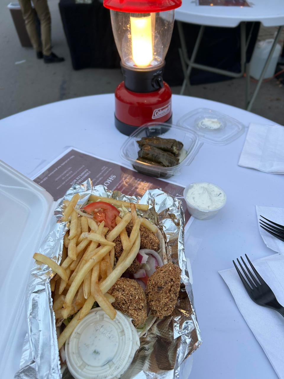 Falafel, fries and vegetarian grape leaves served by lantern light at the Fire & Ice Festival in New Brighton.