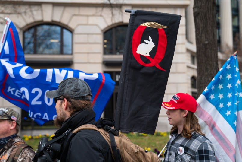 WASHINGTON, DC – JANUARY 05: A Q-Anon sign is seen as President Donald Trump supporters hold a rally on January 5, 2021 in Washington, DC. Today’s rally kicks off two days of pro-Trump events fueled by President Trump’s continued claims of election fraud and a last-ditch effort to overturn the results before Congress finalizes them on January 6. (Photo by Robert Nickelsberg/Getty Images)