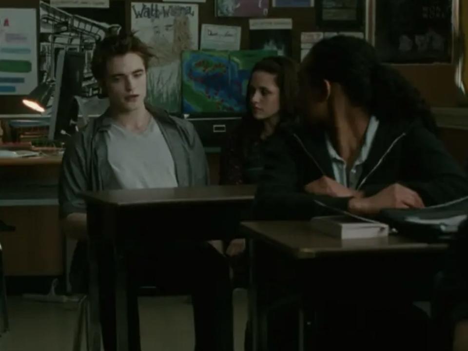 Edward, Bella, and a classmate in school in "Twilight"