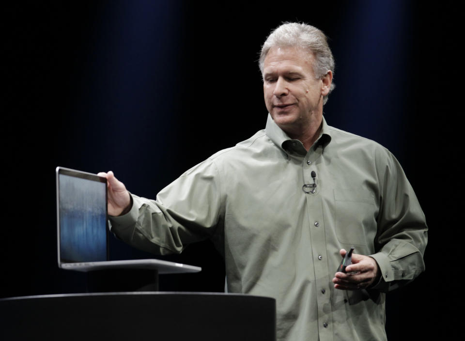 Apple's Phil Schiller speaks about the new MacBook Pro at the Apple Developers Conference in San Francisco, Monday, June 11, 2012. The MacBook Pro, will get a new Intel chip and prices for the 13-inch model will be $1,199 to $1,499, while a 15-inch model will be $1,799 or $2,199, depending on the amount of storage. The new MacBook Air and MacBook Pro models will start shipping Monday. (AP Photo/Paul Sakuma)