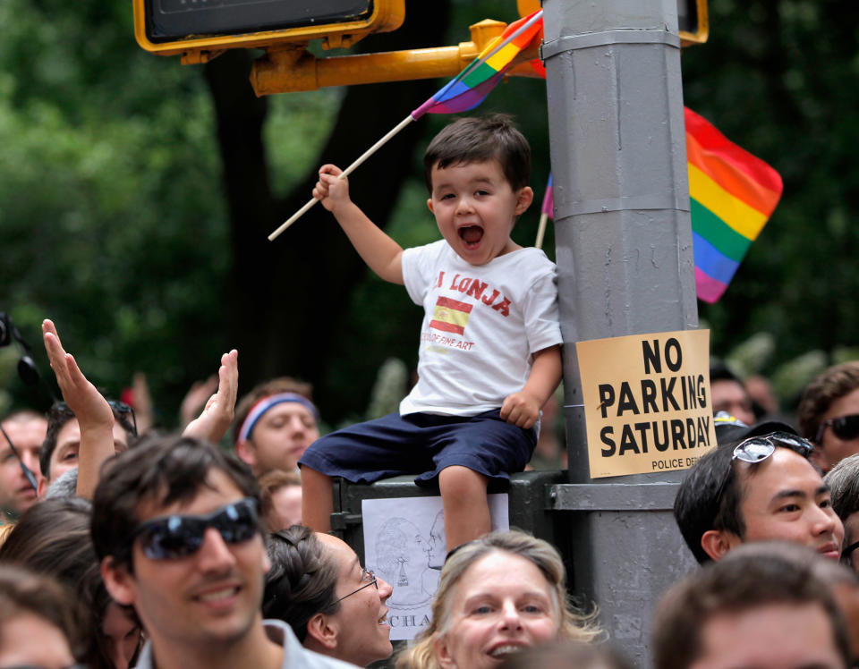 A young boy waves a flag during the 2011 NYC LGBT Pride march on the streets of Manhattan on June 26, 2011 in New York City. (Photo by Jemal Countess/Getty Images)