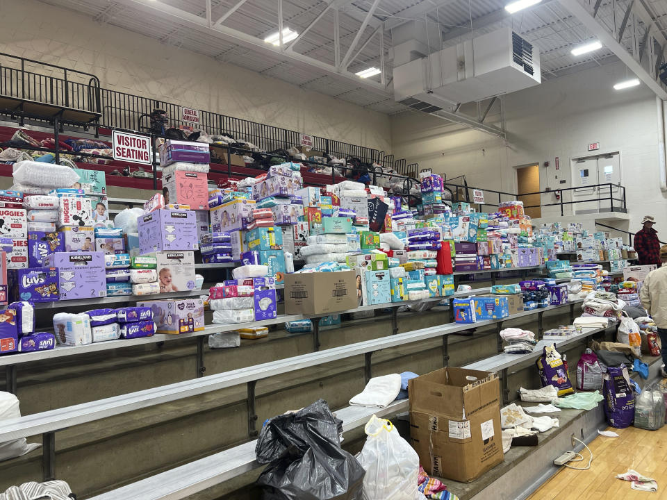 Diapers are stacked inside the gym at Indian Lake High on Saturday, March 16, 2024, in Indian Lake, Logan County, Ohio. The high school has become a donation center after a tornado swept through the Indian Lake area Thursday. in Indian Lake, in Logan County, Ohio. The Indian Lake area in Ohio’s Logan County was one of the hardest hit (AP Photo/Patrick Orsagos)