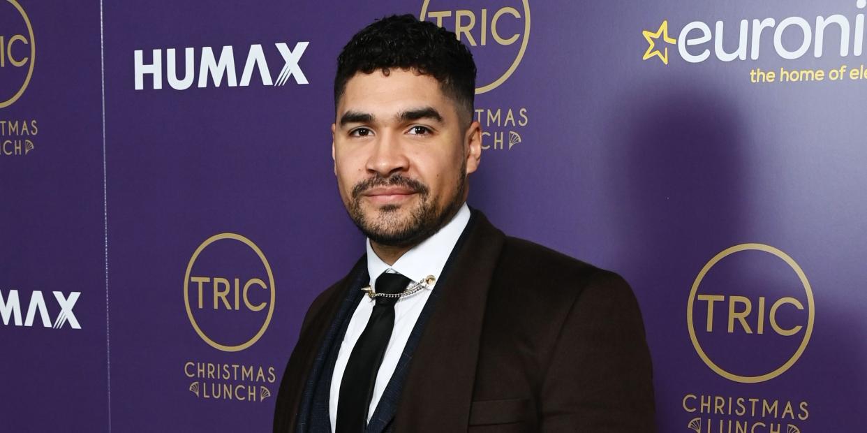 louis smith wearing a suit at the tric awards lunch in december 2022