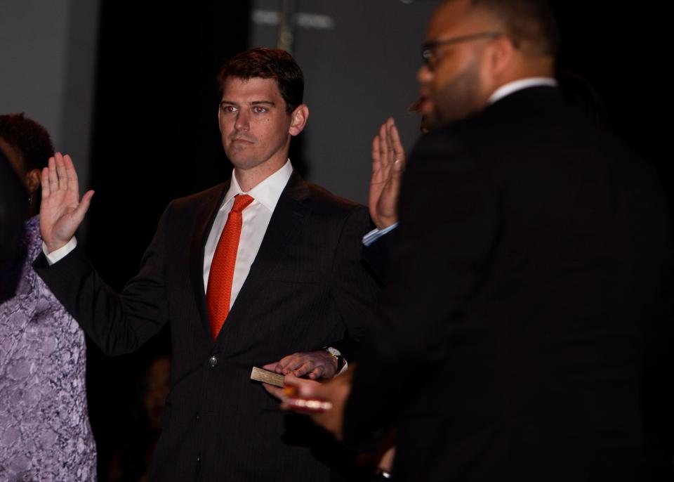 City Councilman Worth Morgan takes the oath of office as he is sworn in on January 1, 2020 at the Michael D. Rose Theatre Lecture Hall.