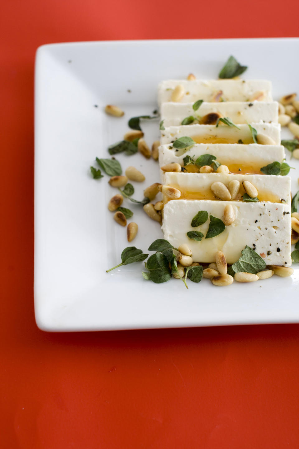 In this undated image, feta cheese and honey are shown served on a platter in Concord, N.H. (AP Photo/Matthew Mead)