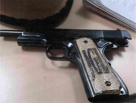 FILE PHOTO: A diamond-encrusted pistol that government witness Jesus Zambada said belonged to the accused Mexican drug lord Joaquin "El Chapo" Guzman, is shown in this government evidence photo at his trial for drug smuggling, in Brooklyn federal court in New York, U.S., November 19, 2018. Courtesy U.S. Department of Justice (DOJ)/Handout via REUTERS