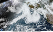 This image provided by the National Hurricane Center and Central Pacific Hurricane Center/National Oceanic and Atmospheric Administration shows a satellite view over Alaska, Friday, Sept. 16, 2022. (NOAA via AP)