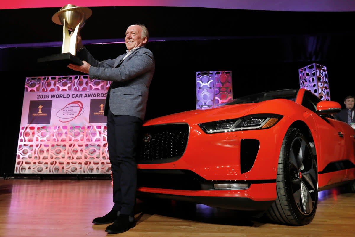 In this April 17, 2019 file photo, Jaguar Design Director Ian Callum raises the World Car of the Year trophy that was awarded to the Jaguar I-Pace (Copyright 2019 The Associated Press. All rights reserved.)