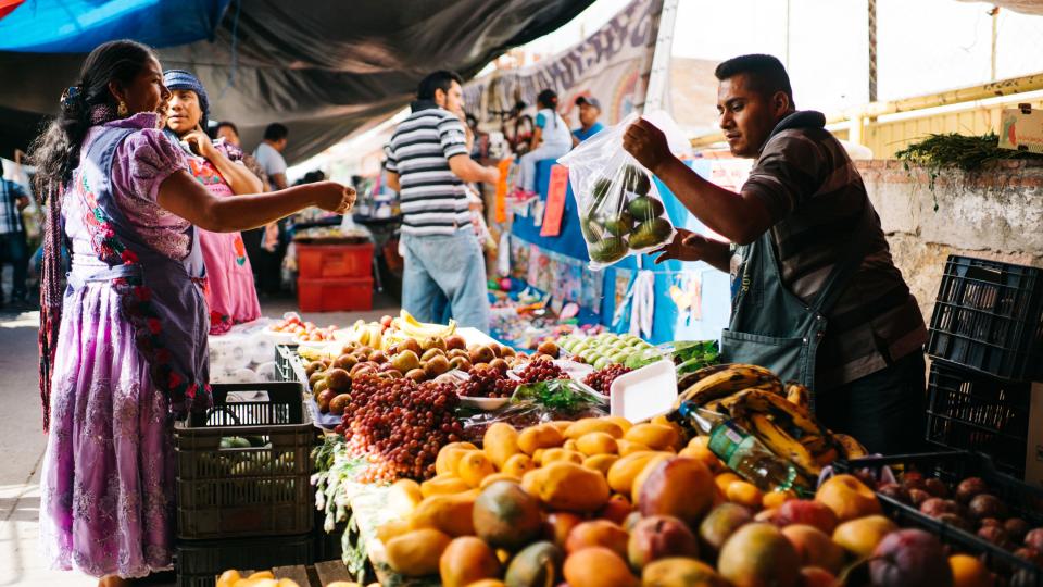 Here, Macrina and another woman from her village purchase produce from one of the hundreds of vendors at the Sunday market in Tlacolula, Oaxaca. The creation of this image was quite a miraculous occurrence, as I visited this market about five days after my visit to the red clay village, and it was only after taking this image and taking a closer look weeks later that I realized it was none other than Macrina. This market, which occurs only on Sundays, was massive in scale, spanning acres of land with hundreds of stalls and thousands of patrons, attracting visitors and patrons from the dozens of surrounding communities.