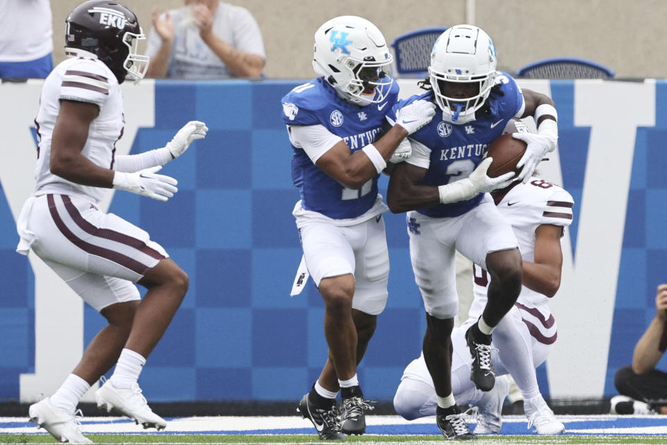 Kentucky defensive back Zion Childress (11) and defensive back Maxwell Hairston (31) celebrate an interception in the end zone during the first half of an NCAA college football game against Eastern Kentucky in Lexington, Ky., Saturday, Sept. 9, 2023. (AP Photo/Michelle Haas Hutchins)