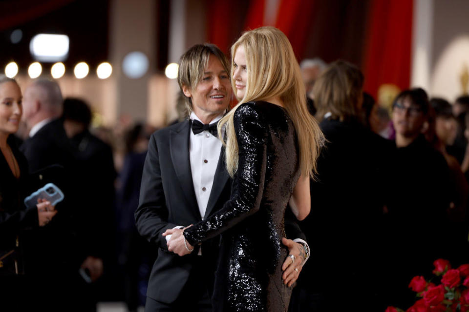 Keith Urban and Nicole Kidman embrace at the 95th Annual Academy Awards