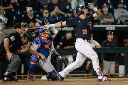 Jun 21, 2018; Omaha, NE, USA; Texas Tech Red Raiders designated hitter Zach Rheams (18) flies out to deep center field to end the eighth inning against the Florida Gators in the College World Series at TD Ameritrade Park. Mandatory Credit: Steven Branscombe-USA TODAY Sports