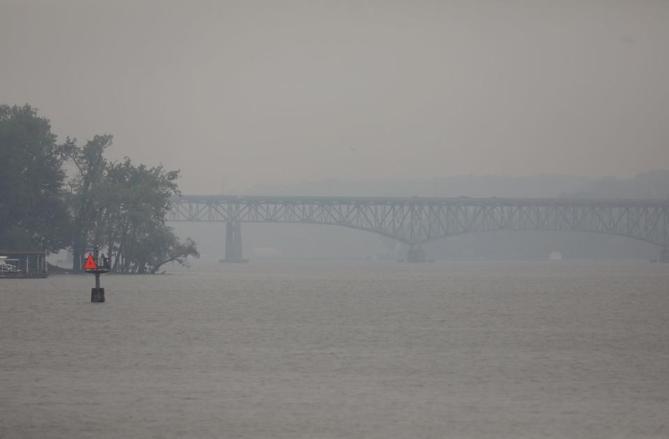 Smog from the wildfires in Canada have been making their way across the upper United States. The Bay Bridge in Irondequoit Bay is barely visible through the smog.