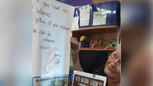 Brenda Douglas was forced to put up a sign telling customers they won't be served if they are on their phones. Source: Supplied