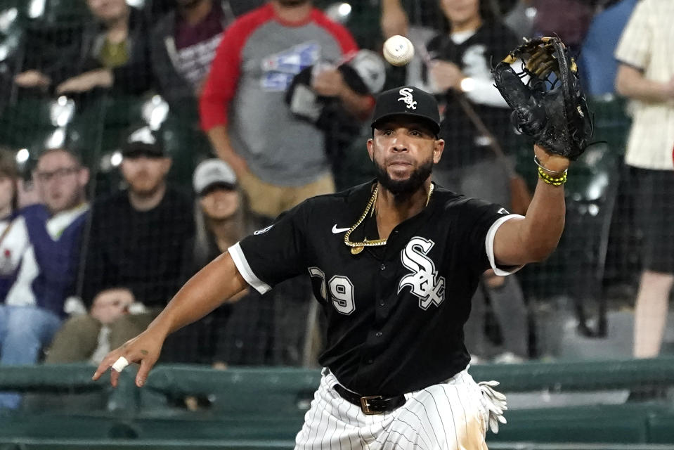 FILE - Chicago White Sox first baseman Jose Abreu waits for a throw during the team's baseball game against the Cincinnati Reds on Sept. 29, 2021, in Chicago. With a bolstered bullpen and hopes for a full season from young outfielders Luis Robert and Eloy Jimenez, Abreu is confident in his team's ability to defend the AL Central title and make a deeper postseason run. (AP Photo/Charles Rex Arbogast, File)