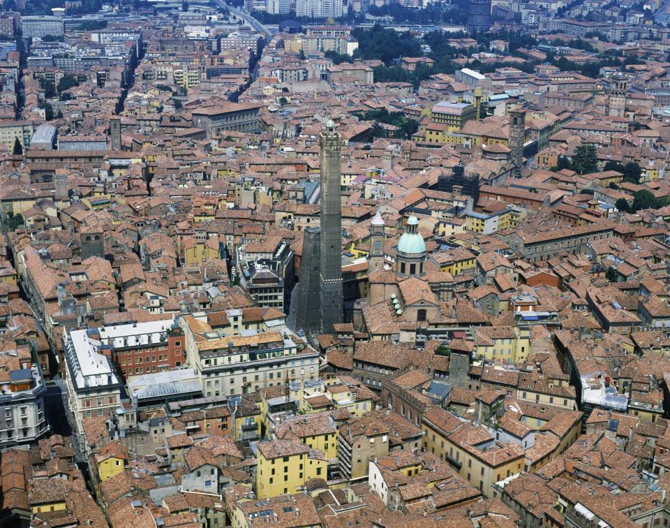 The center of Bologna with the Asinelli Tower and the Garisenda Tower seen from above, in Emilia-Romagna, Italy. / Credit: DE AGOSTINI PICTURE LIBRARY / Getty Images