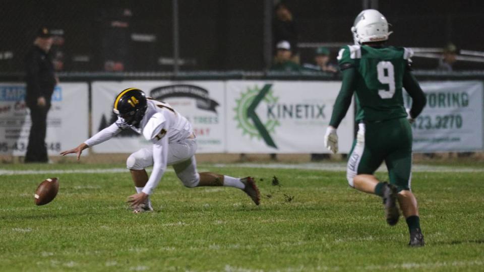 Kicker Ben Oetman chases down a high snap. Walker Craven pursues. San Luis Obispo High School won 17-14 over Templeton in the last game of football’s regular football.