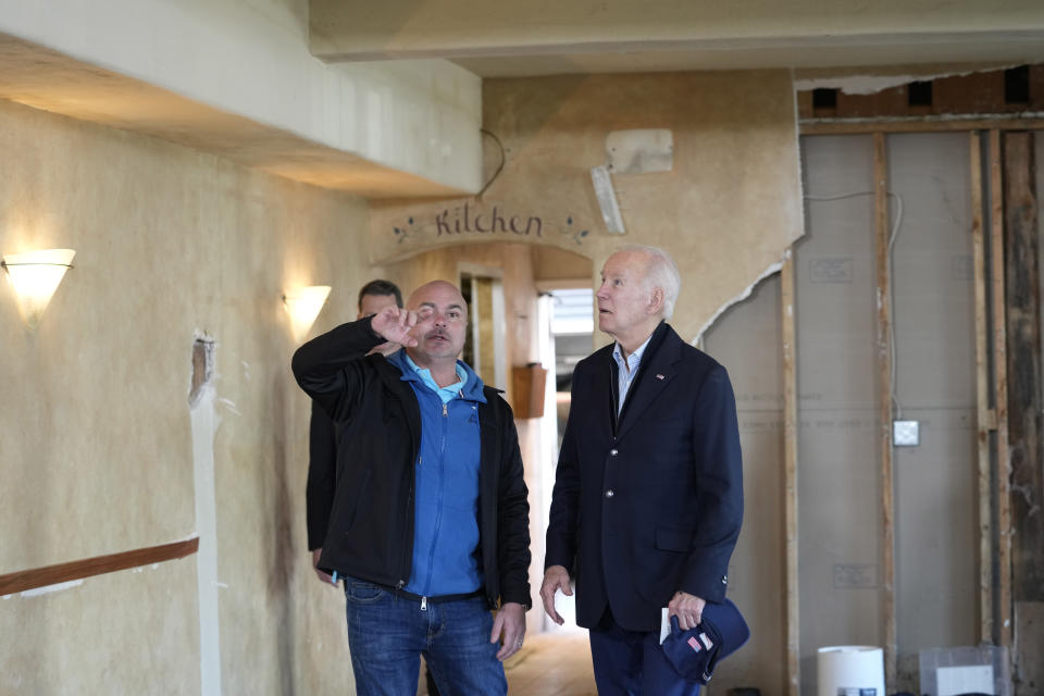 President Joe Biden talks with Paradise Beach Grille co-owner Chuck Maier as he visitswith business owners and local residentsin Capitola,Calif., Thursday, Jan 19, 2023,to survey recovery efforts following a series of severe storms. (AP Photo/Susan Walsh)