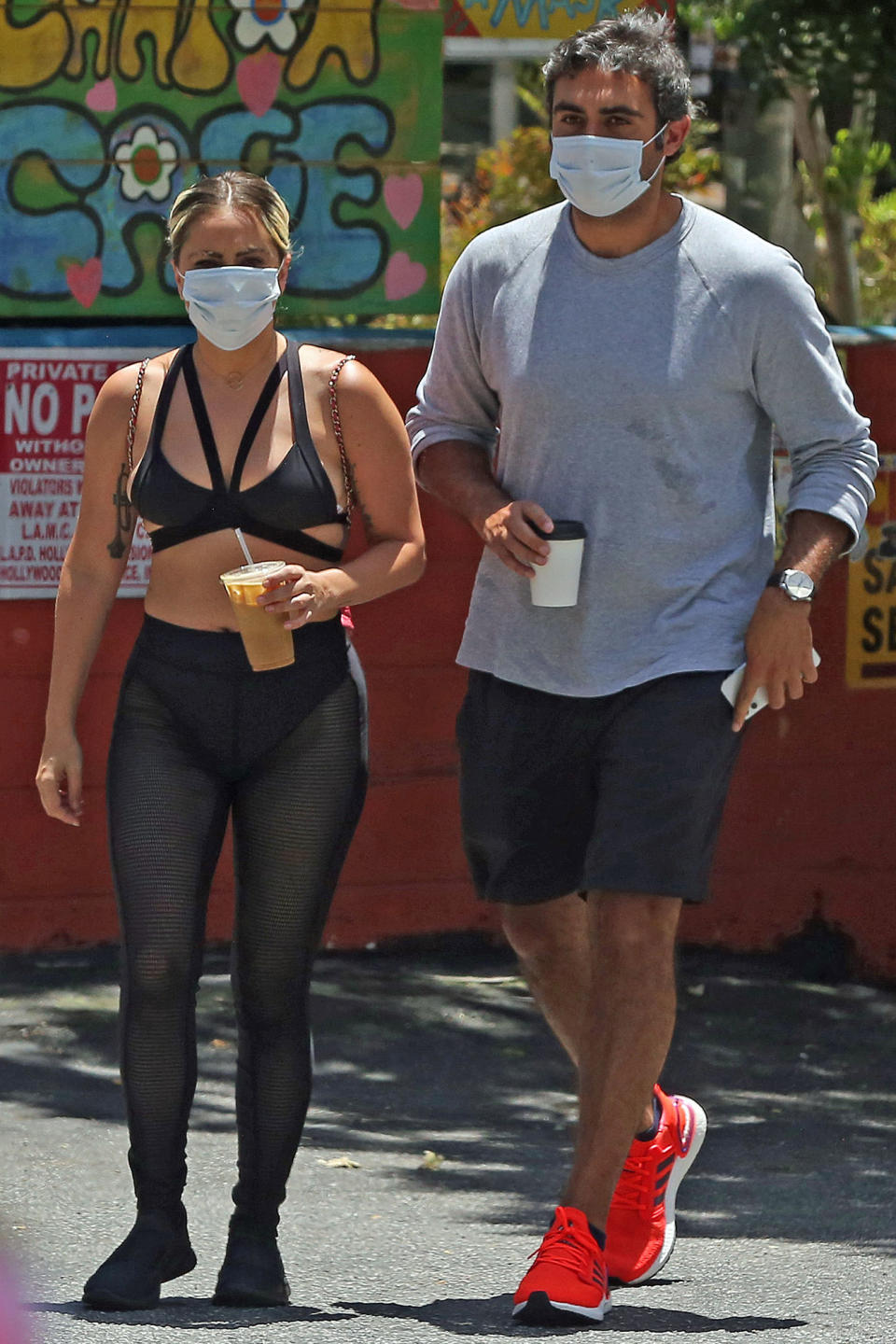 <p>Lady Gaga and her boyfriend Michael Polansky wear their face masks during a Saturday coffee run in Los Angeles.</p>