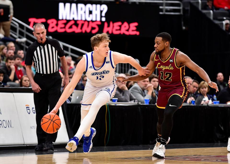 Loyola Ramblers guard Marquise Kennedy defends Tucker DeVries during the first half in the MVC Championship.