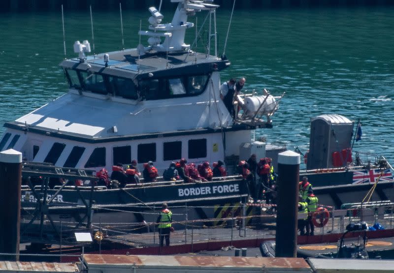 Migrants arrive in the UK after crossing the English Channel